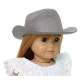 A doll wearing a gray cowboy hat designed for 18-inch dolls.