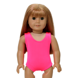 An 18-inch doll wearing a hot pink sleeveless gymnastics/dance leotard.