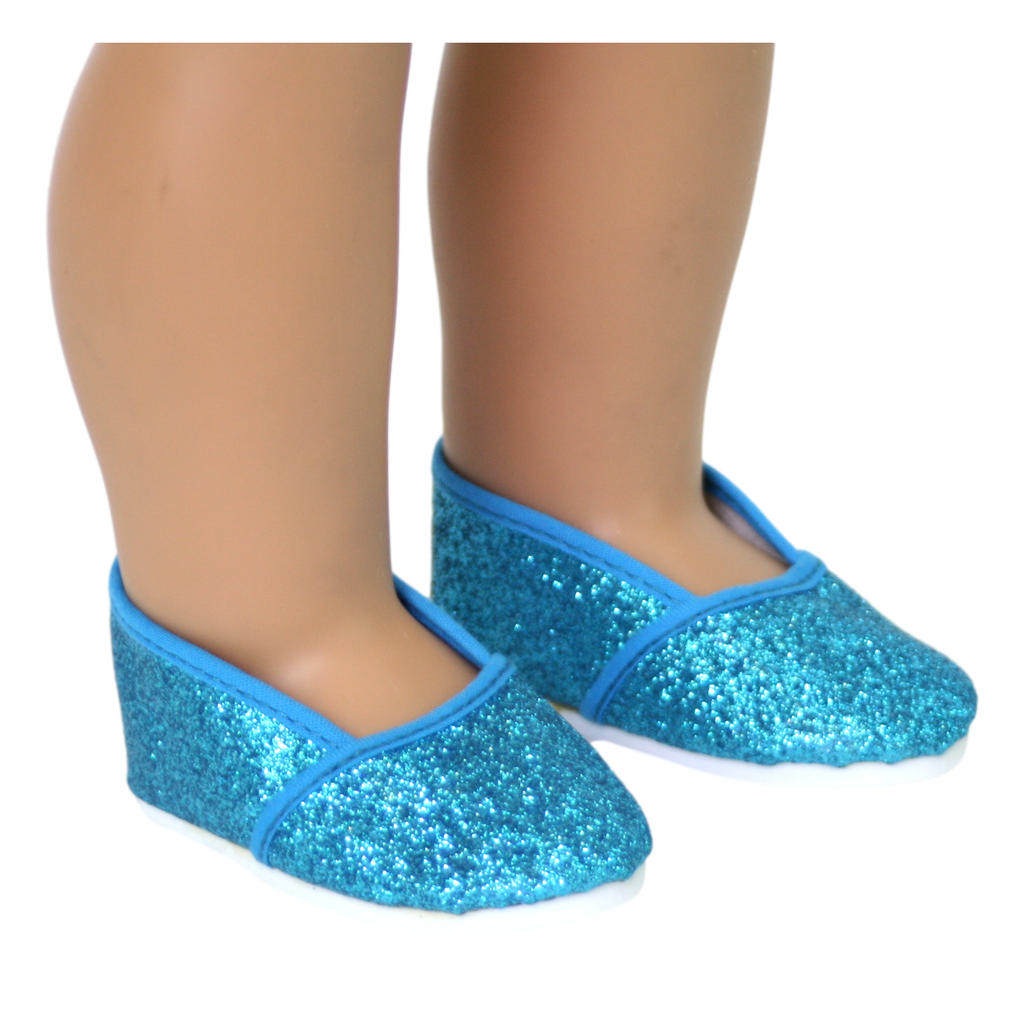 A pair of turquoise glitter slip-on shoes designed for 18-inch dolls, displayed on a doll's feet.