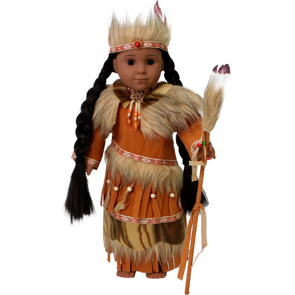 An 18-inch doll dressed in a Native American-inspired outfit, including a brown faux suede dress with fur trim, a matching headband, and an Indian staff with fur and a feather.