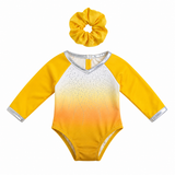 Gold ombre gymnastics leotard with sparkling rhinestones, silver trim, and matching gold scrunchie that fits an 18=inch doll