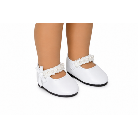 White Mary Jane style shoes with pearl trim and bows, shown on a doll's feet against a white background.