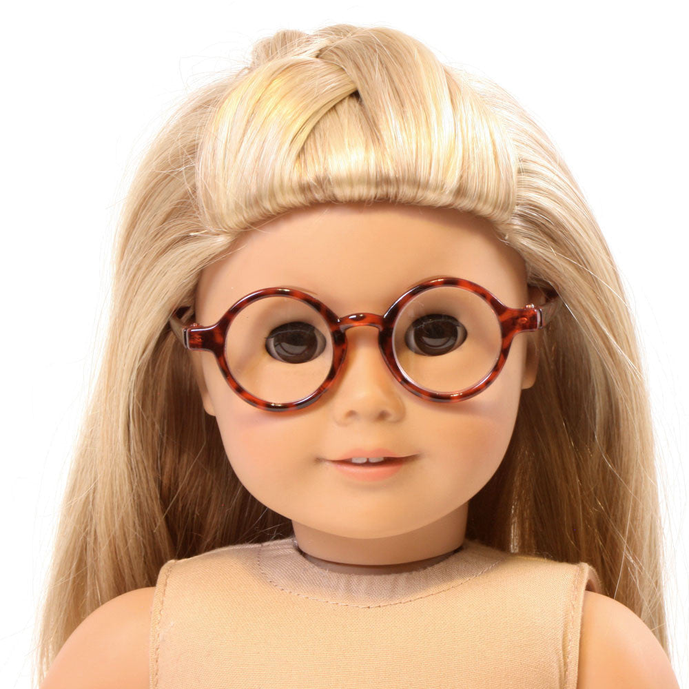 Round tortoise shell glasses with brown and amber frames displayed on an 18-inch doll.